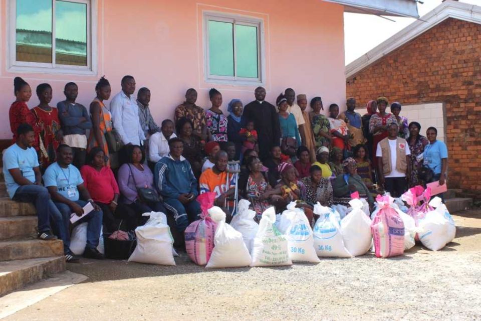 Caritas Bamenda staff distributing support to displaced families
